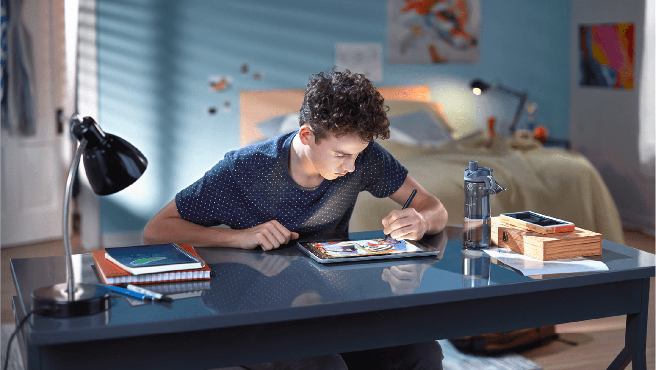 young student working on a device