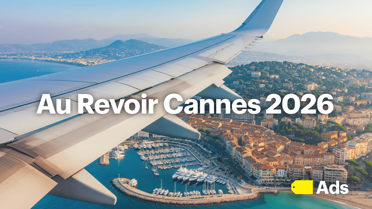 View of Cannes France from window of an airplane with copy, "Au Revoir Cannes 2026."