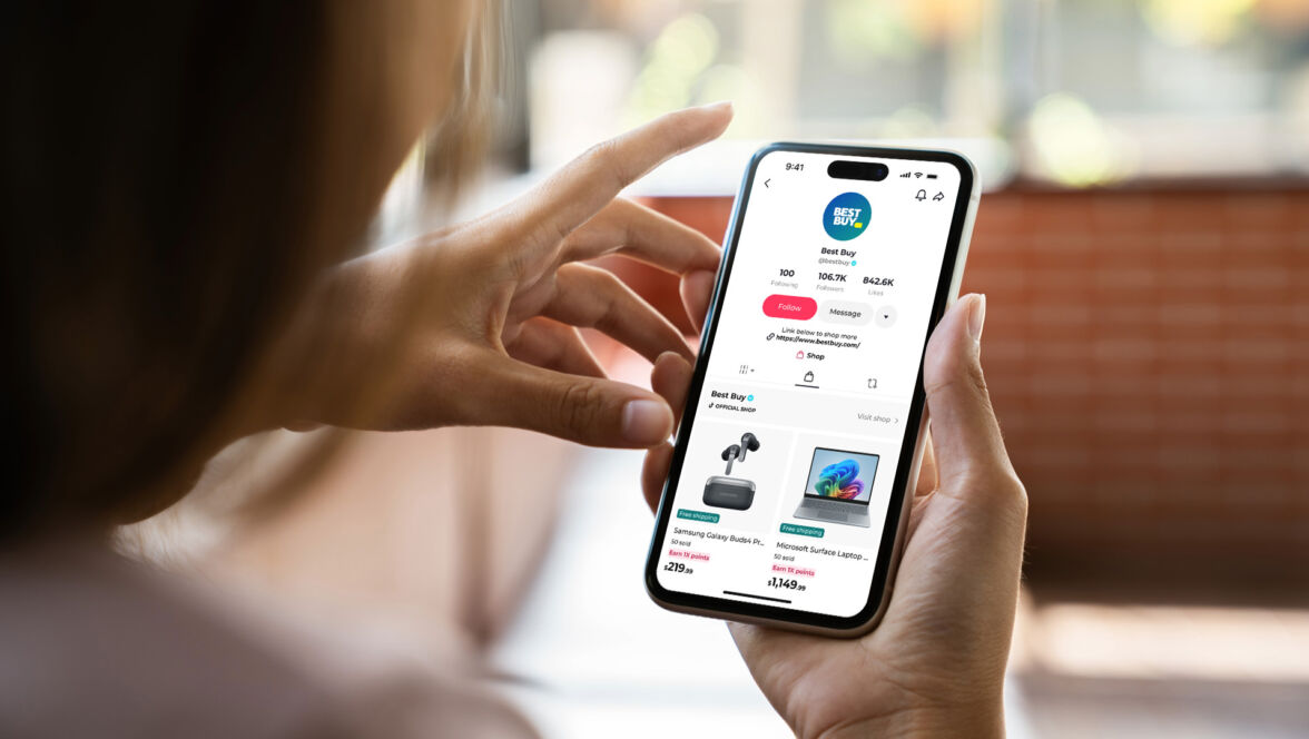 Person on smartphone looking at Best Buy's TikTok Shop.